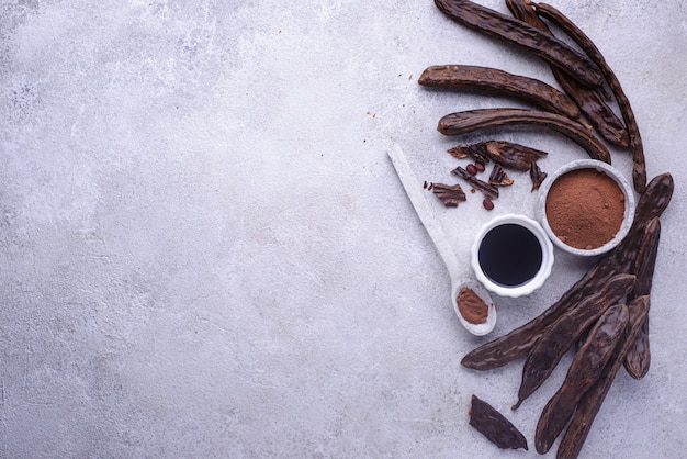 Carob pods powder and molasses or syrup