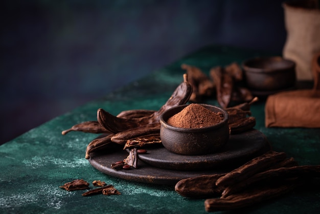 Carob pods powder and molasses or syrup