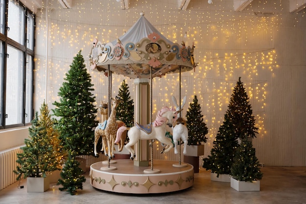 Carousel with animals in the interior of the room