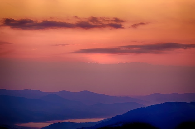 Carpathian mountains summer sunset landscape with dramatic pink sky natural background