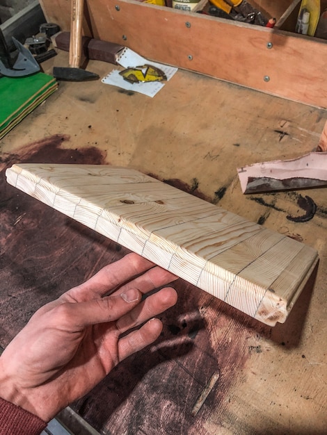 Carpenter does his job, wood processing by hand.