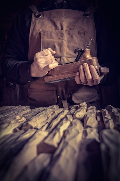 Carpenter holding a planer