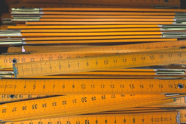 Photo carpenter's ruler many folding wooden rulers for carpenters