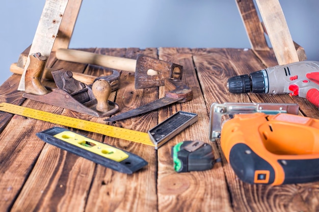 carpenter tools on wood table background