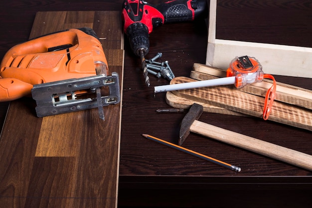 carpenter tools on wood table background