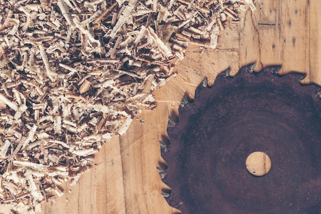 Carpenter tools on wooden table with sawdust. Carpenter workplace top view