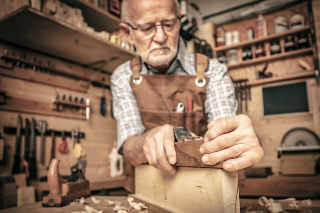 Carpenter uses a planer