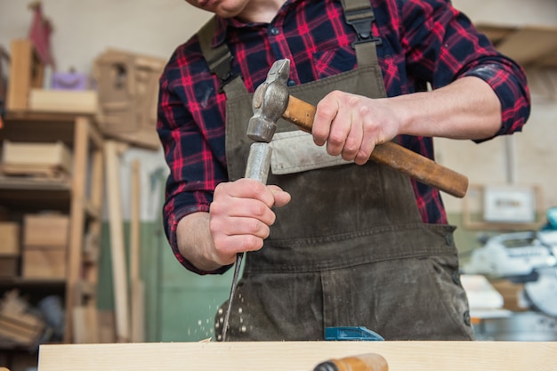 Carpenter working with a chisel