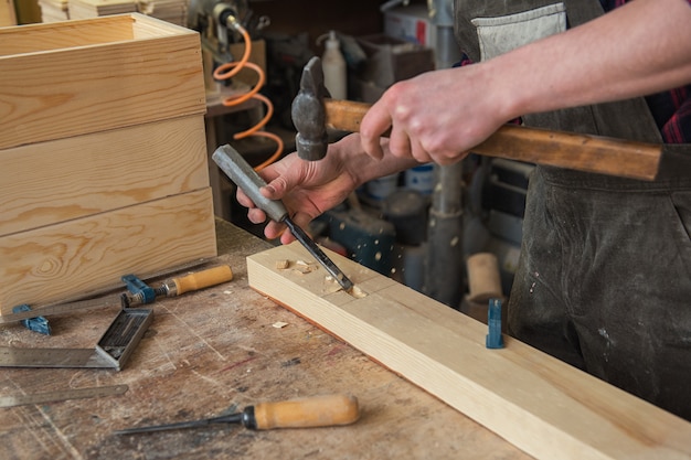 Carpenter working with a chisel