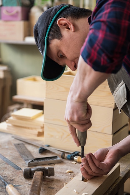 Carpenter working with a chisel