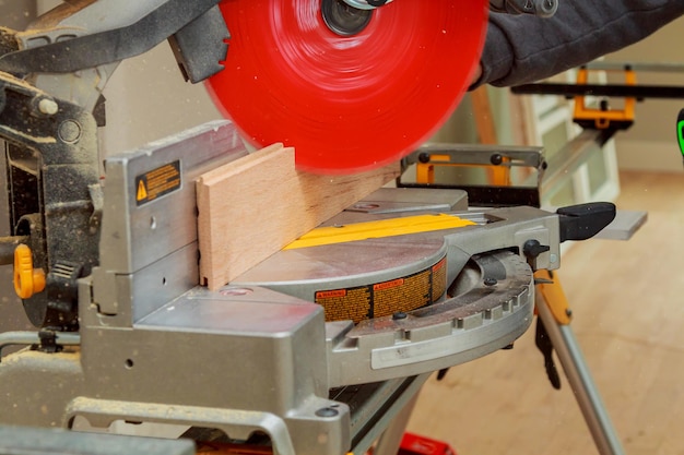 Carpenter workplace Man using circular saw cut wood