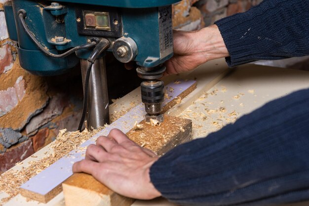 A carpenter works in a furniture workshop