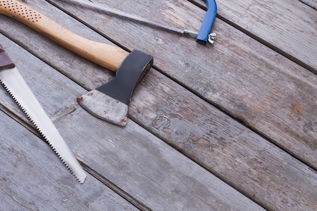 Carpentry tools on wooden background