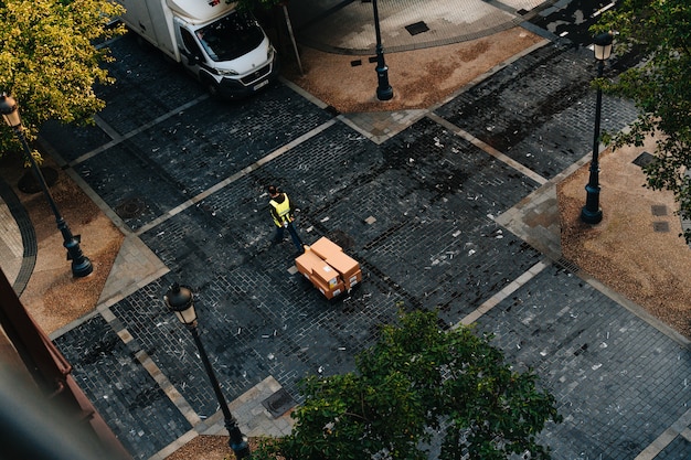 Carrier carrying order boxes to truck