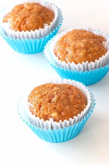 Carrot apple oats muffins white background Selective focus Healthy breakfast and autumn food concept