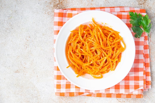 Carrot salad fresh vegetable beta carotene spicy spices healthy meal food snack on the table