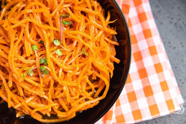 Carrot salad vegetable beta carotene fresh healthy meal food snack on the table