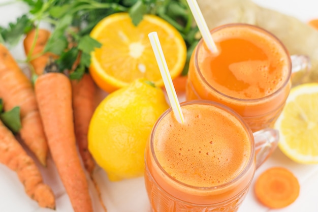 Carrot smoothie with orange, lemon and ginger root.