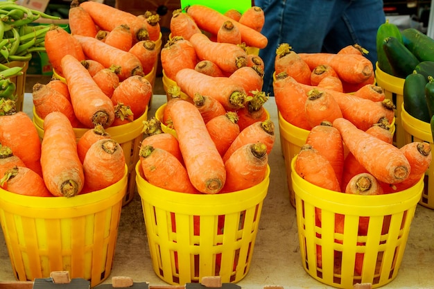 Carrots at a farmers market carrot in a basket on a bazaar