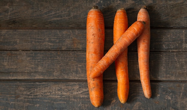 Carrots lie on wooden boards Concept market vegetables carrots