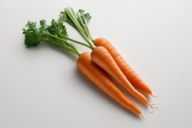 Carrots on a white background with green leaves