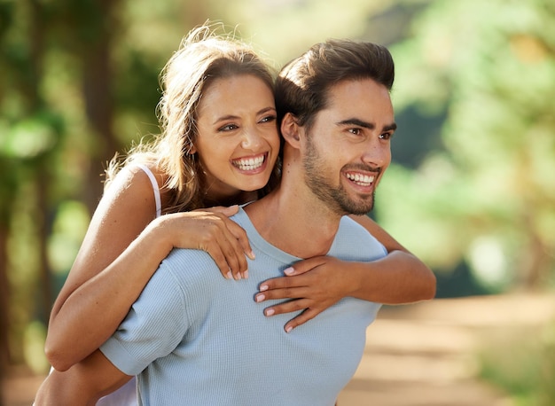 Carry me there. Shot of an affectionate couple spending time together outdoors.