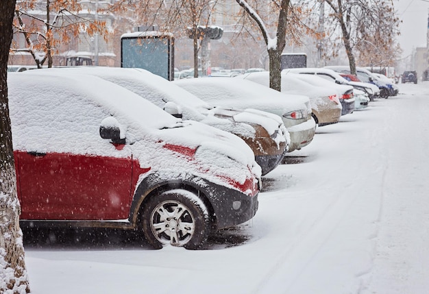 Photo cars are covered with snow in wintertime