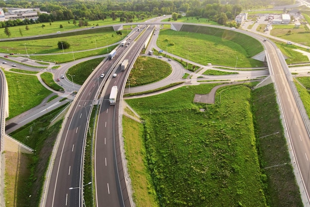 Cars moving on transport road junction in city aerial view