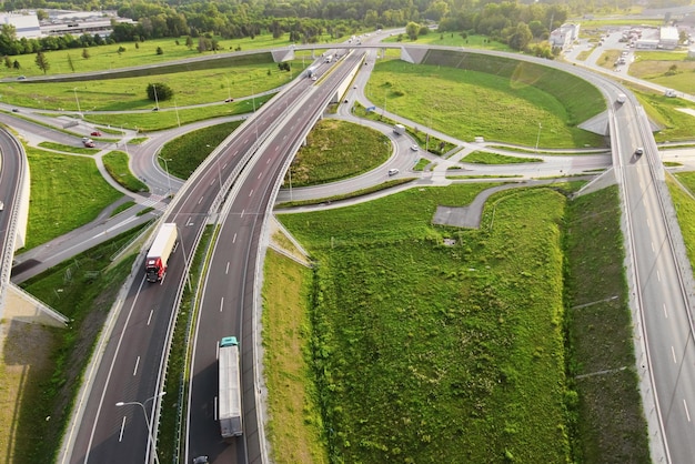 Cars moving on transport road junction in city aerial view