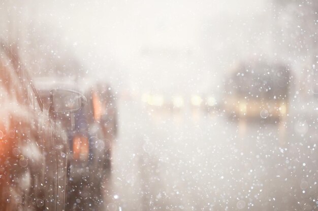 cars on winter road traffic jam city / winter weather on the city highway, the view from car in the fog and snow road