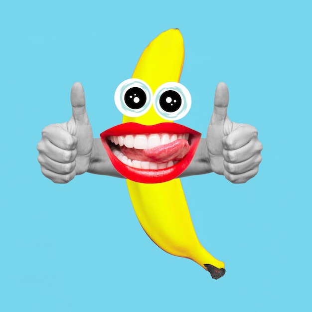 Photo cartoon banana with mouth with red lips showing tongue showing thumb up gesture with hands