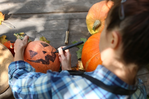 Carve pumpkins for Halloween