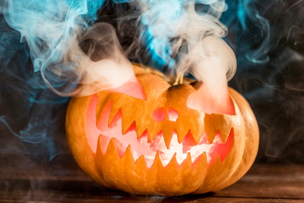 Carved pumpkin with smoke