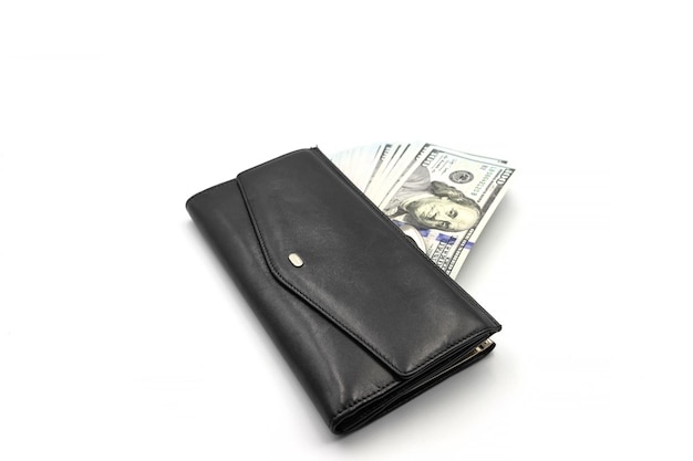 Cash from one hundred dollar bills in a wallet on a white background A lot of US dollars in a black wallet