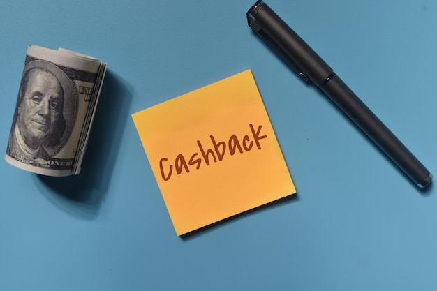 Cashback wording with a money and pen. Business and financial concept