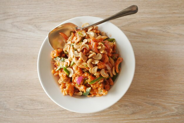 Cashew nut salad on a plate on table