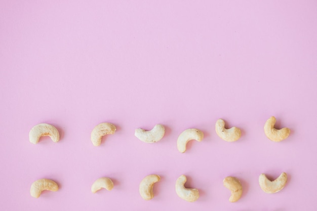 Cashew nuts isolated on pink background