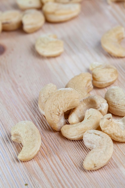 Cashew nuts lying on a white board