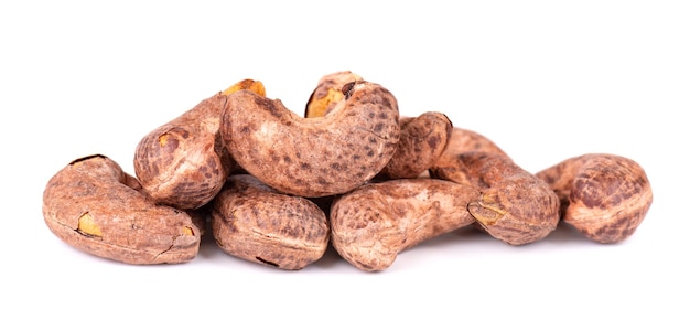 Cashew nuts in shell isolated on white background Roasted and salted cashew nuts