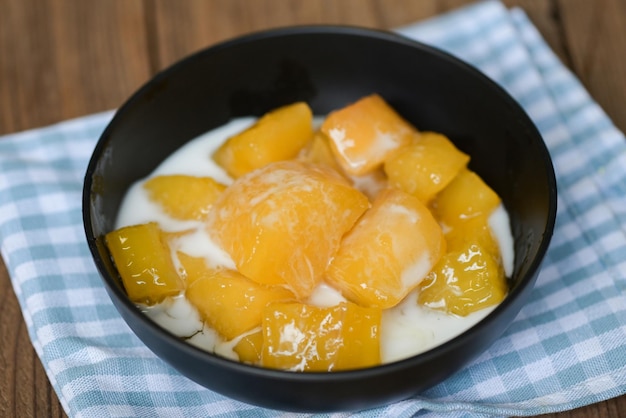 Cassava food on the table food sweet dessert made of boiled cassava sugar and coconut milik Thai food