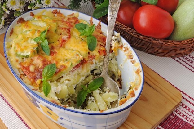 Casserole of pasta with zucchini and tomato cheese