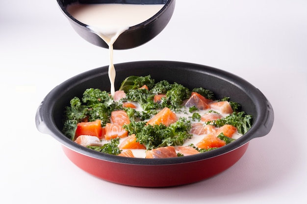 Casserole with salmon eggs cabbage cream round frying pan horizontal orientation