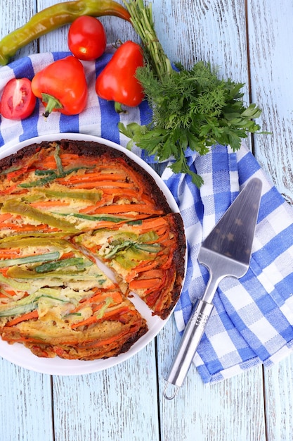 Casserole with vegetables on plate on table closeup