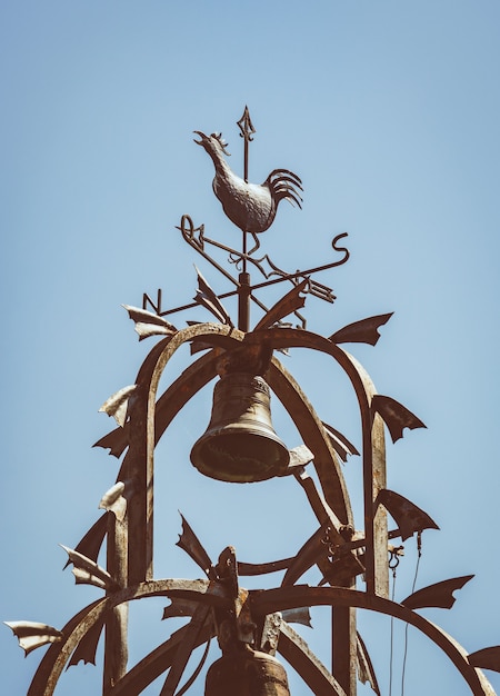 Cast-iron bell tower with an ornamental weathercock