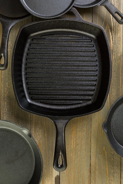 Cast iron skillet on rustic wood table.