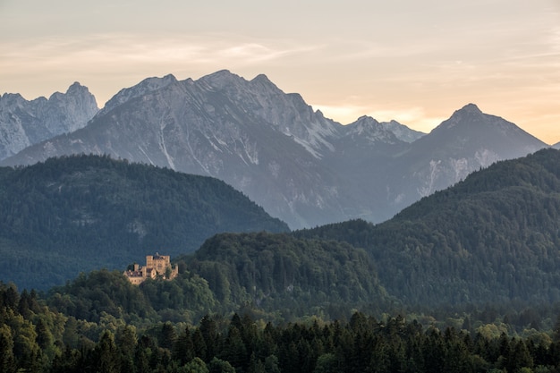 Castle in fantasy landscape summer with sunset