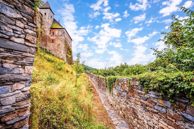 Castle Sovinec Eulenburg robust medieval fortress one of the largest in Moravia Czech republic landscape with medieval castle on a rocky hill above a forest valley