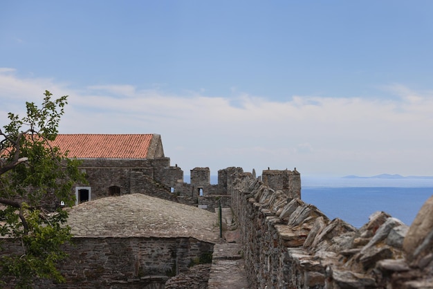 Castle walls horizon consisting of sea and mountain range in Kavala, Greece