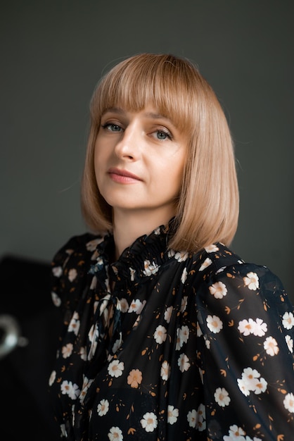 Casual blonde woman portrait on background