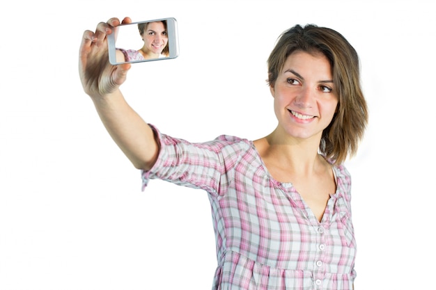 Casual brunette taking a selfie